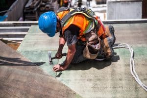 worker on the roof in the heat